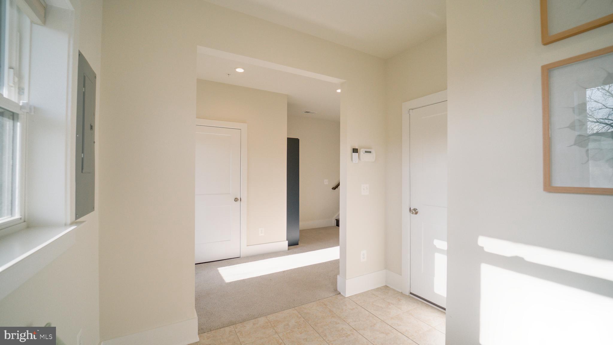 20062 Old Line Terrace Ashburn, VA 20147 - Photo 6 of 79 a view of a hallway with closet and a window