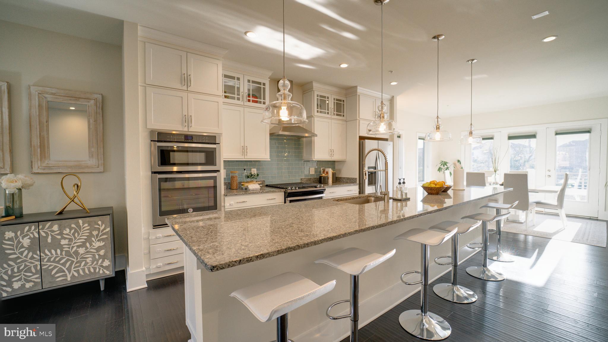 20062 Old Line Terrace Ashburn, VA 20147 - Photo 10 of 79 a kitchen with stainless steel appliances granite countertop a sink refrigerator and cabinets