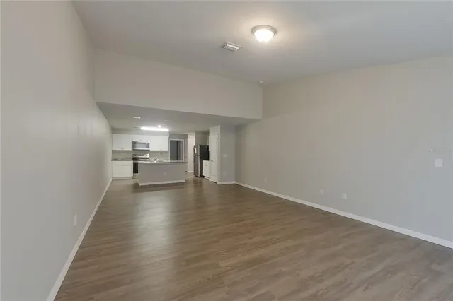 a view of a livingroom with wooden floor