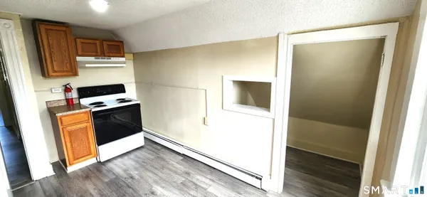a kitchen with a refrigerator and a stove