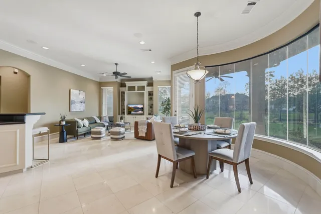 a bath tub sitting in a bathroom next to a window