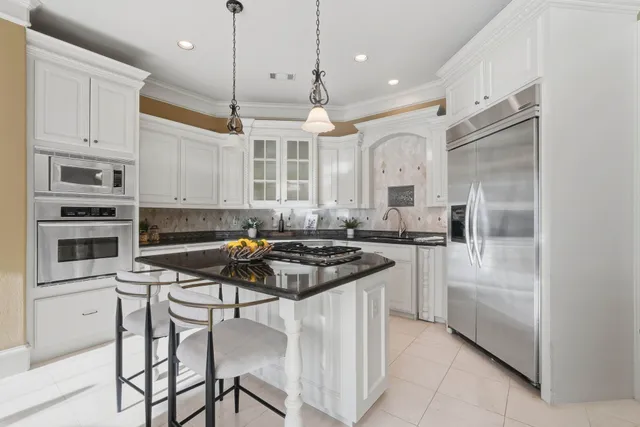 a bathroom with a light fixture and a mirror
