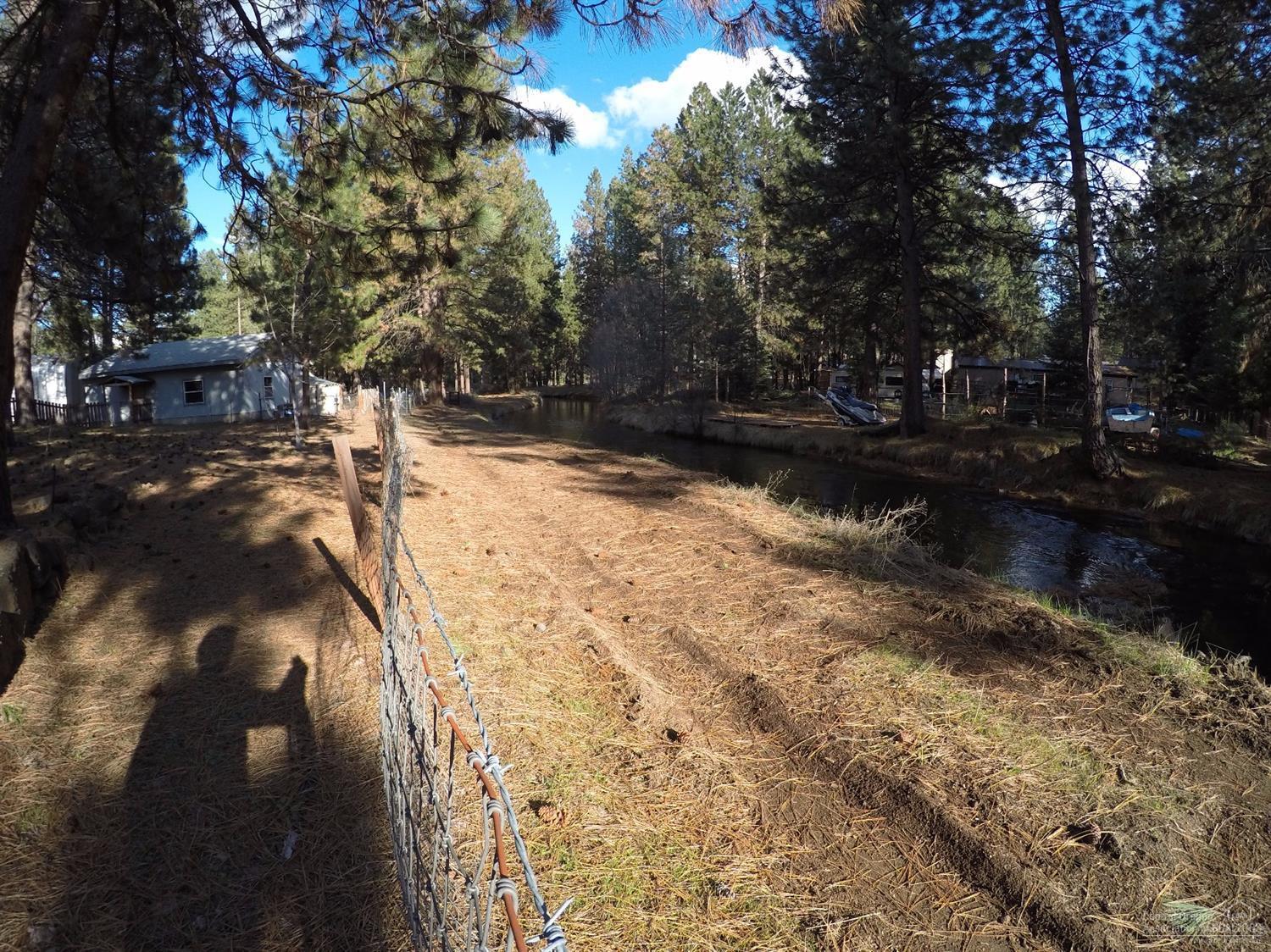 19079 Baker Road Bend, OR 97702 - Photo 9 of 10 a view of water yard with trees