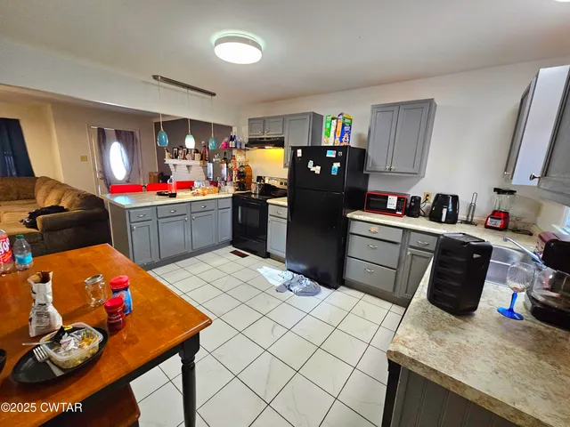 a room with furniture and flat screen tv