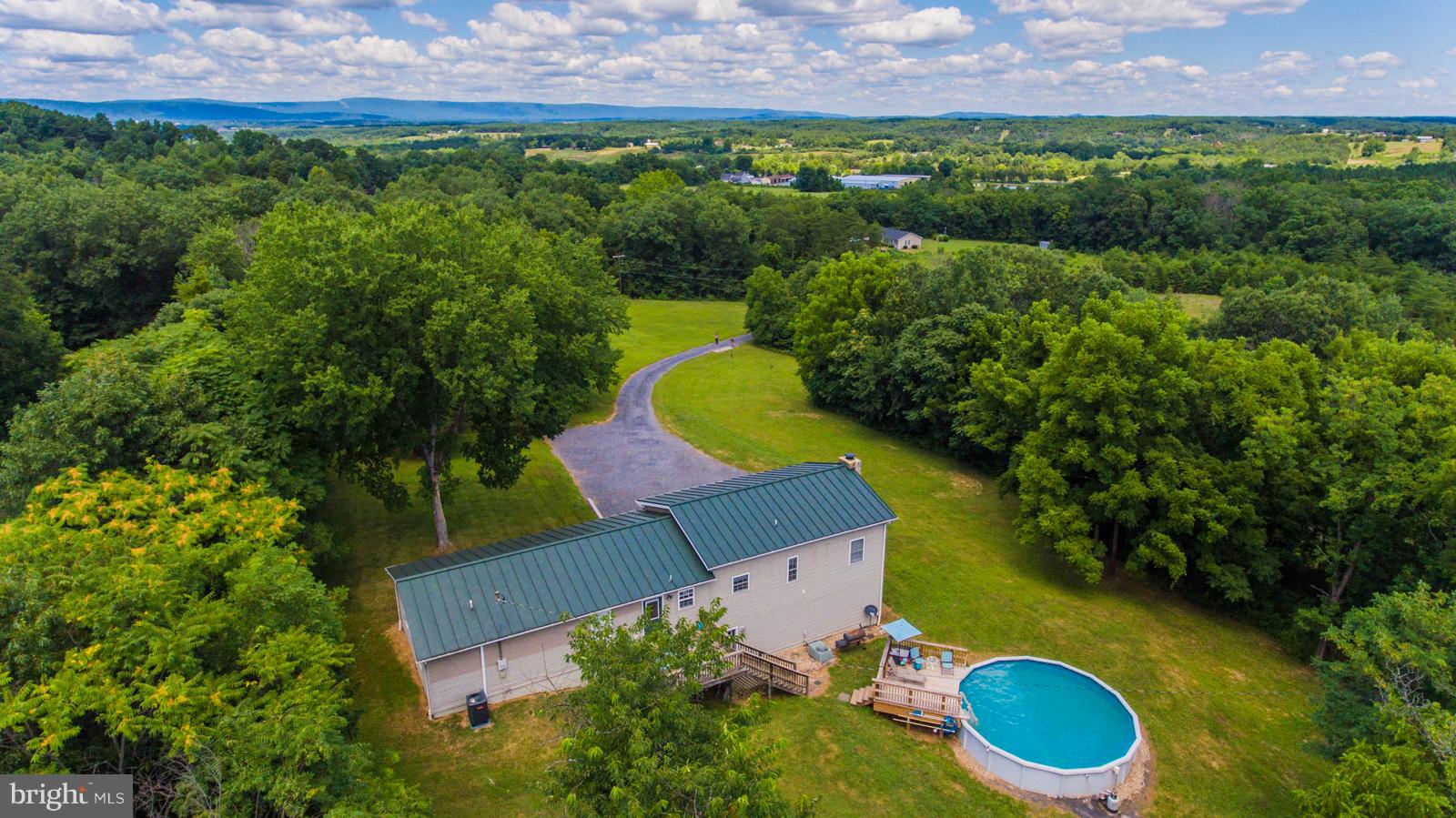 195 Messick Road Strasburg, VA 22657 - Photo 3 of 30 an aerial view of a house with a yard and lake view