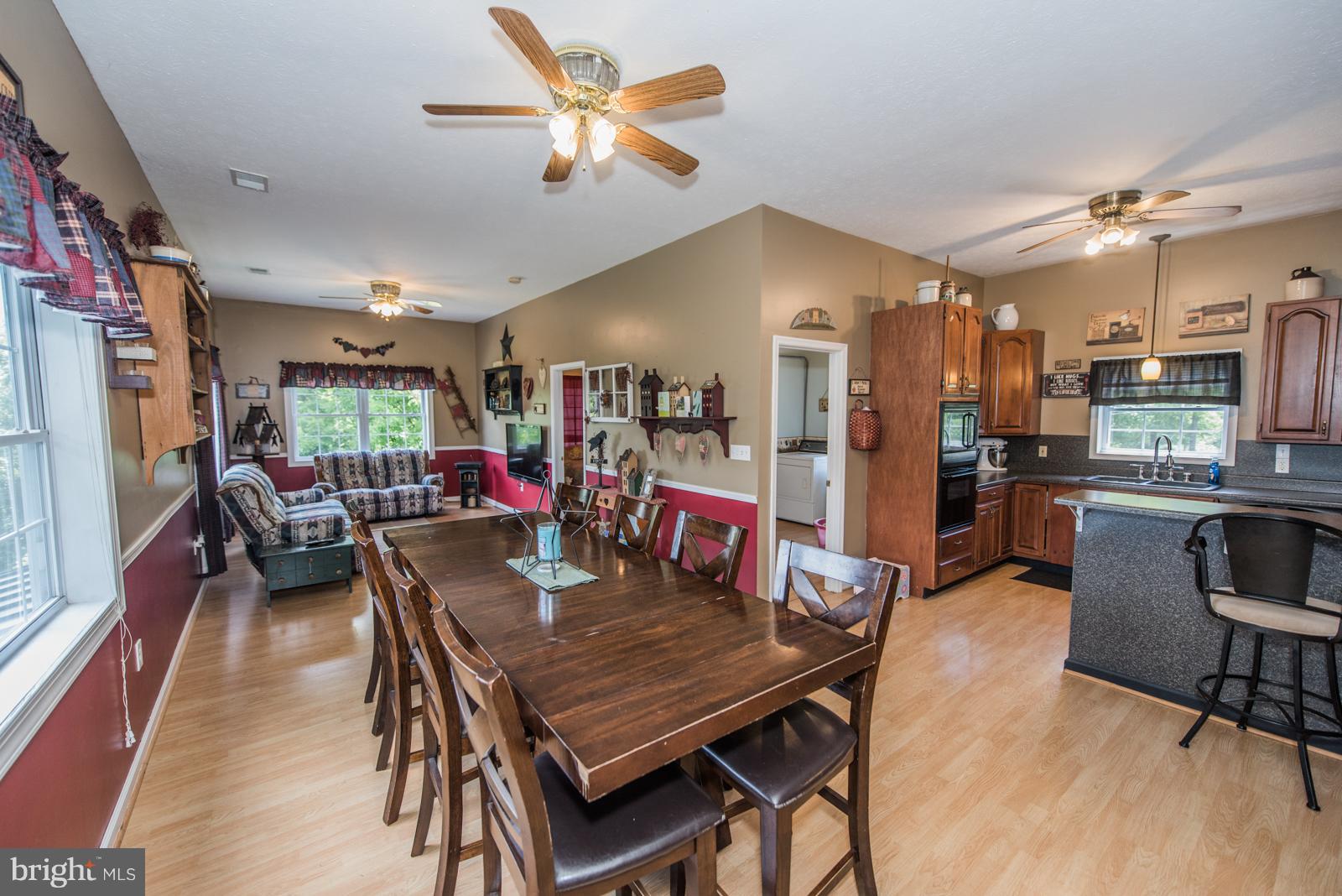 195 Messick Road Strasburg, VA 22657 - Photo 8 of 30 a view of a dining room with furniture and a kitchen