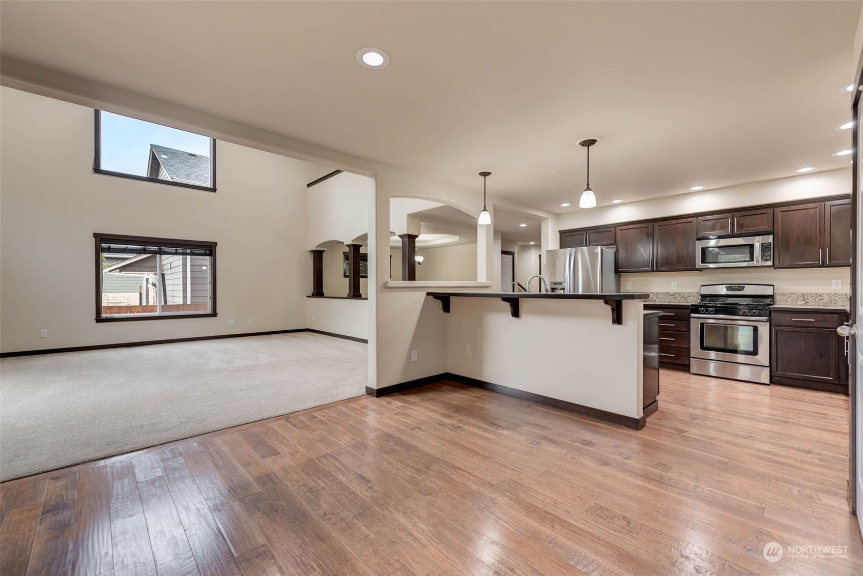 448 Barry Loop Mount Vernon, WA 98274 - Photo 14 of 40 a view of kitchen with wooden floor and electronic appliances