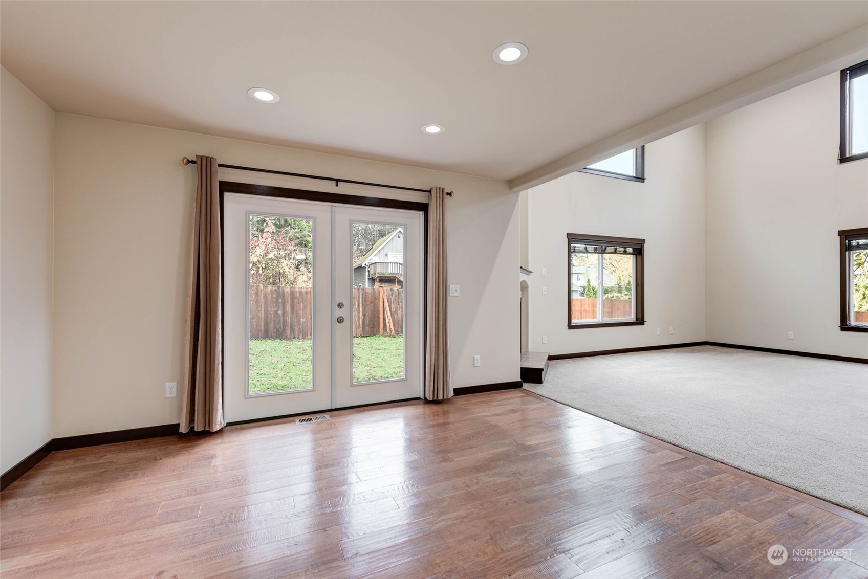 448 Barry Loop Mount Vernon, WA 98274 - Photo 16 of 40 an empty room with wooden floor and front door