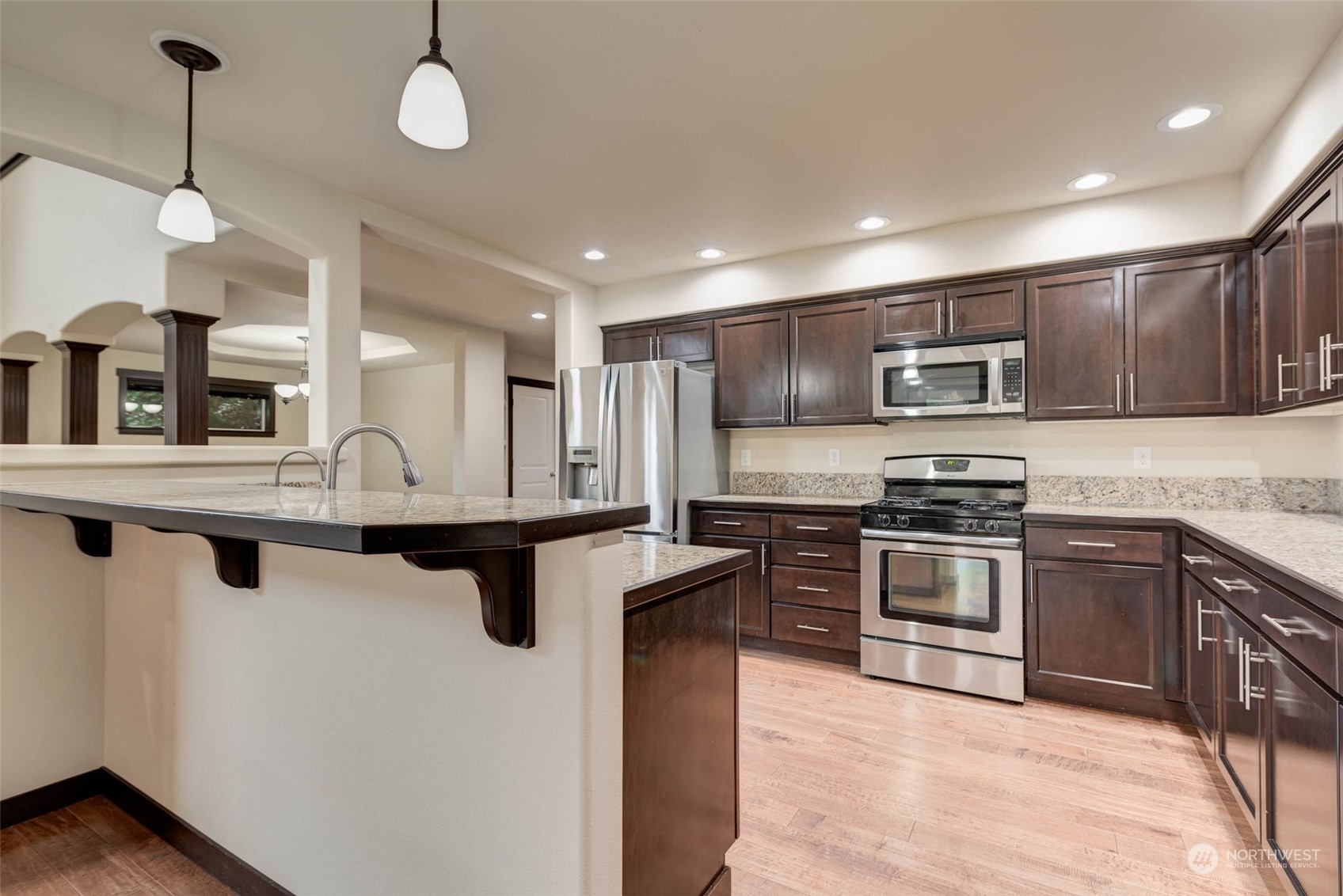 448 Barry Loop Mount Vernon, WA 98274 - Photo 17 of 40 a kitchen with stainless steel appliances granite countertop a sink stove and refrigerator
