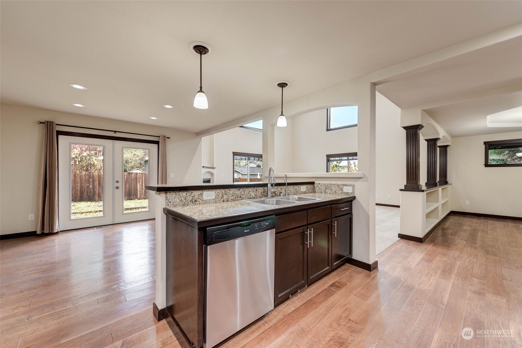 448 Barry Loop Mount Vernon, WA 98274 - Photo 18 of 40 a large kitchen with stainless steel appliances granite countertop a stove and a wooden floors