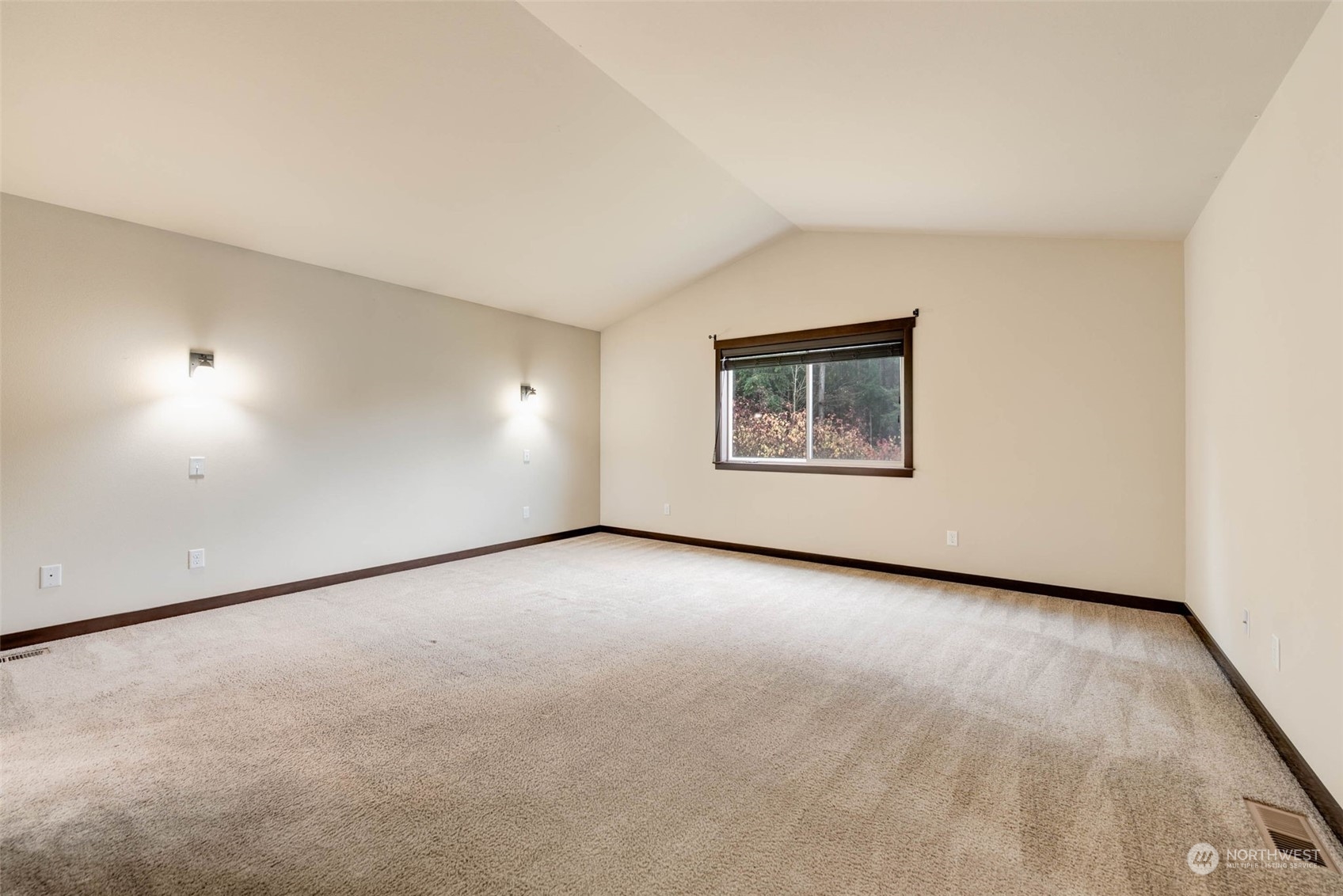 448 Barry Loop Mount Vernon, WA 98274 - Photo 22 of 40 an empty room with a window and a projector