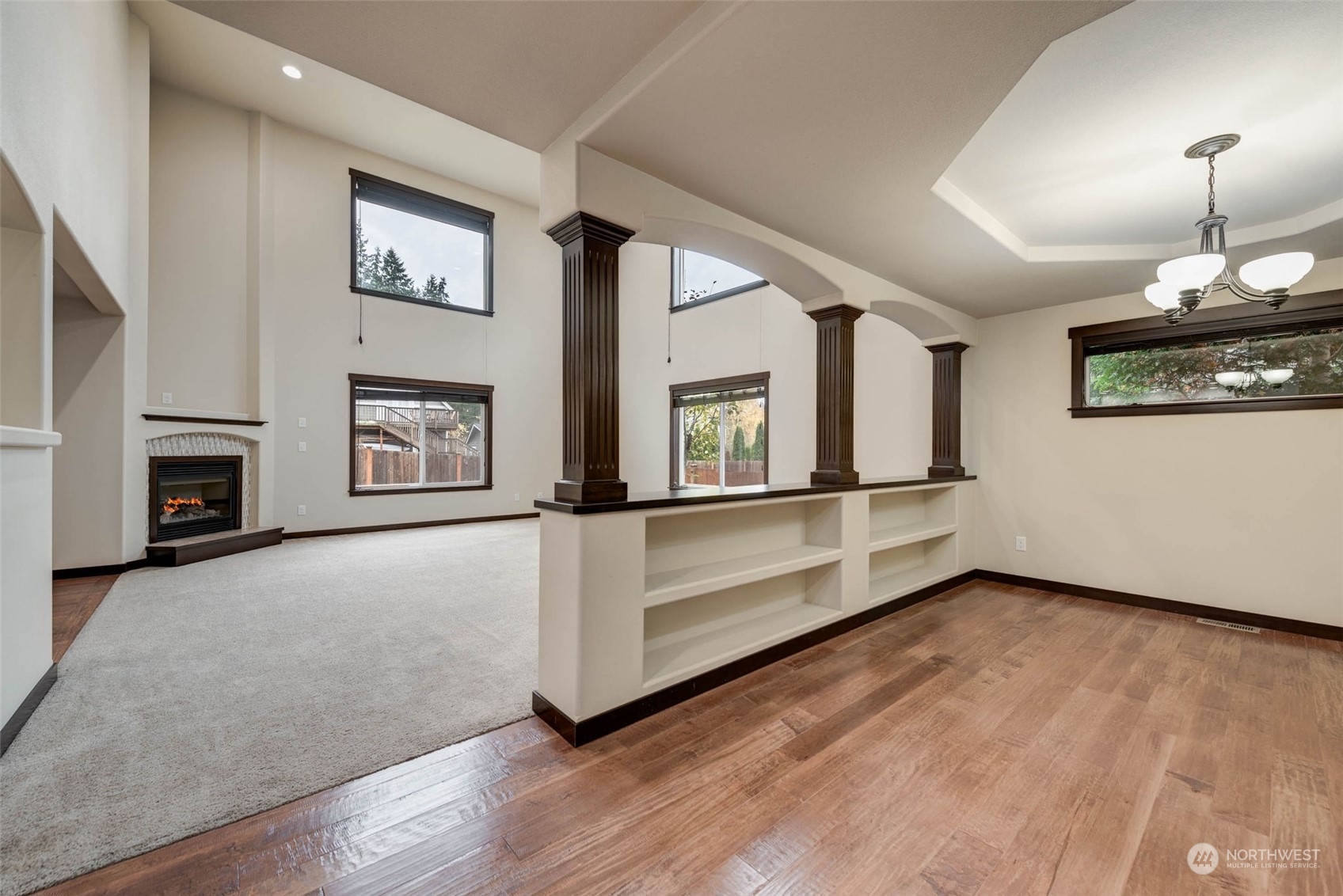 448 Barry Loop Mount Vernon, WA 98274 - Photo 8 of 40 a view of an empty room with a window and fireplace