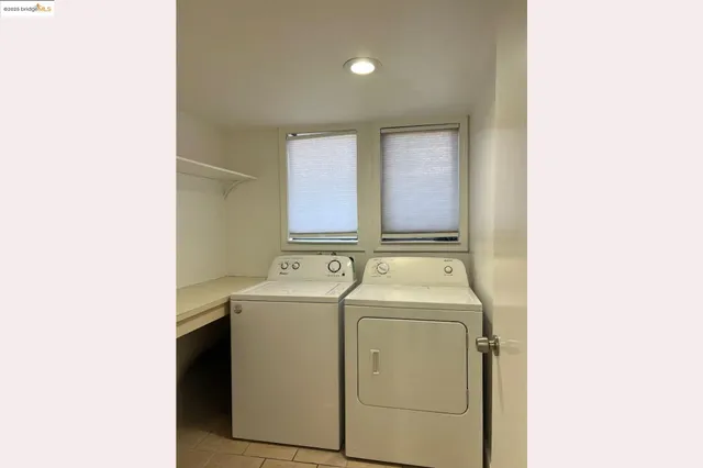 a view of storage and utility room with washer and dryer