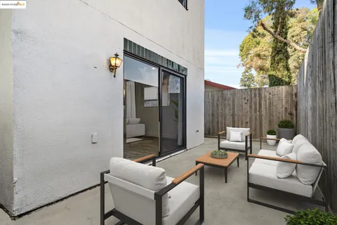 a outdoor space with patio the couches and a potted plant on a table