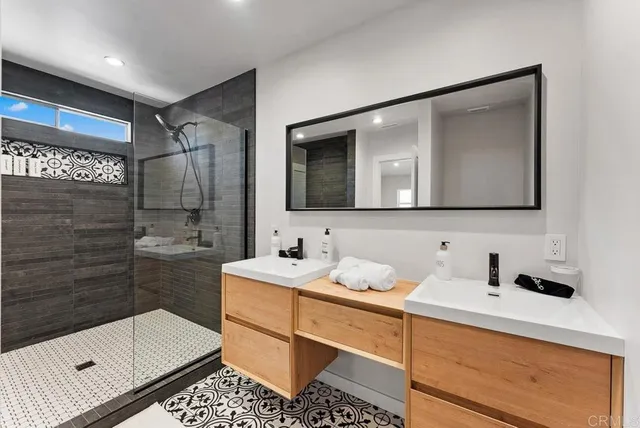 a bathroom with a sink a toilet and mirror
