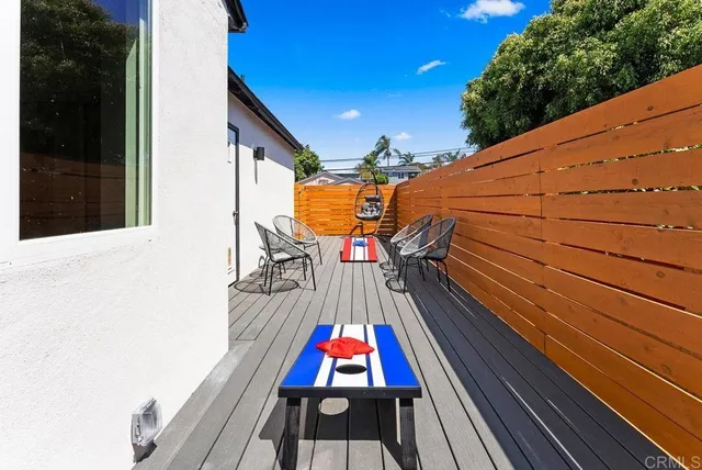 a view of swimming pool with a lounge chairs