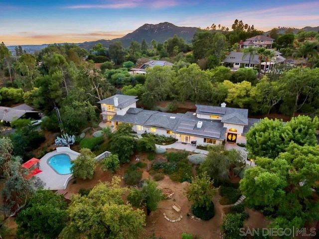 an aerial view of a house with a garden