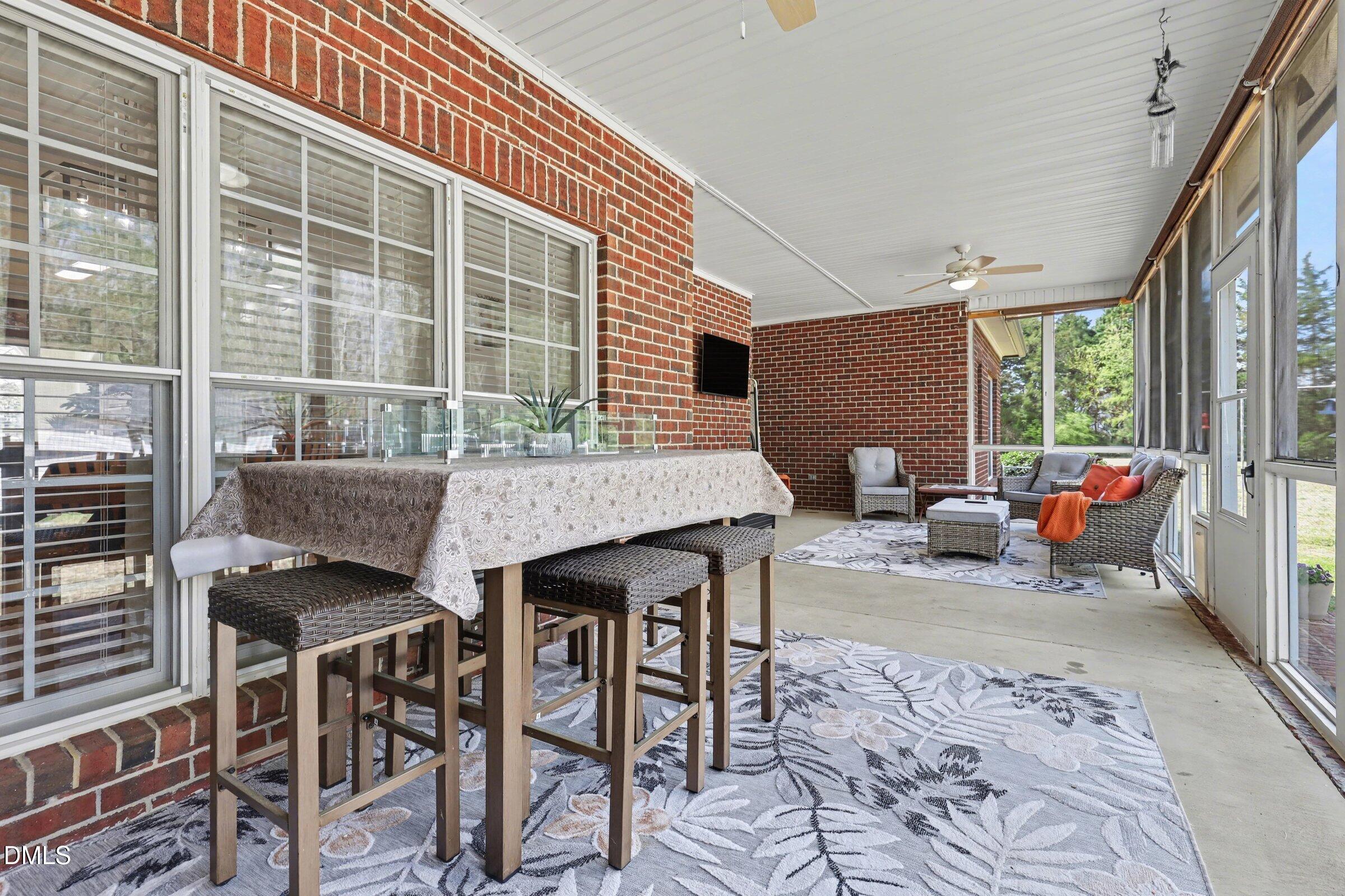 430 Fred Hall Road Stedman, NC 28391 - Photo 28 of 63 a backyard of a house with table and chairs