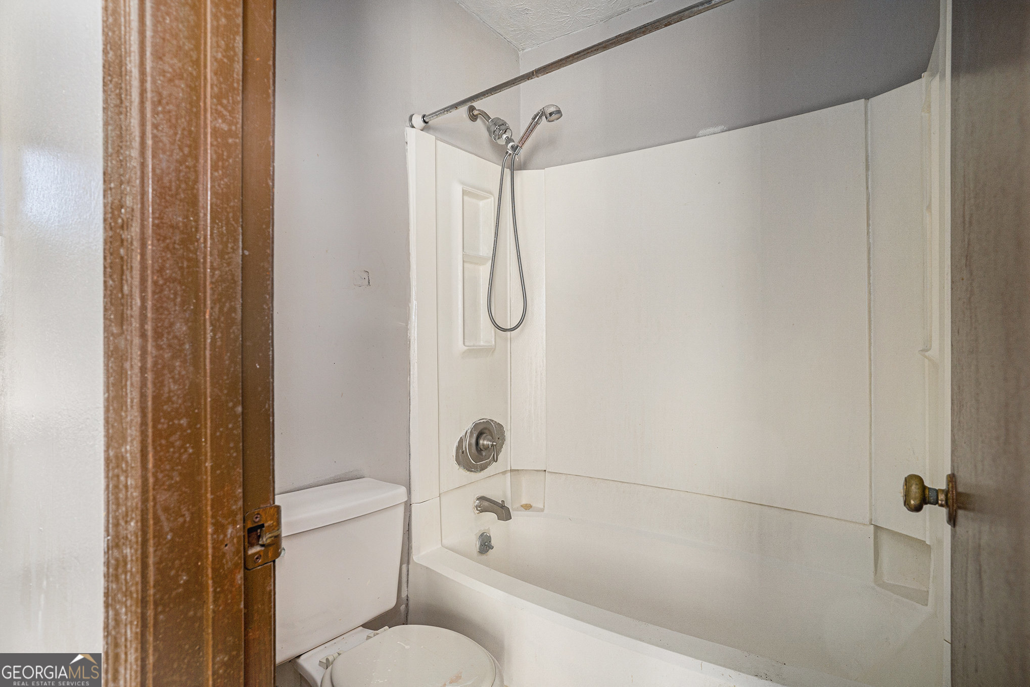 1341 Bethaven Road Riverdale, GA 30296 - Photo 12 of 18 a bathroom with a shower and a toilet