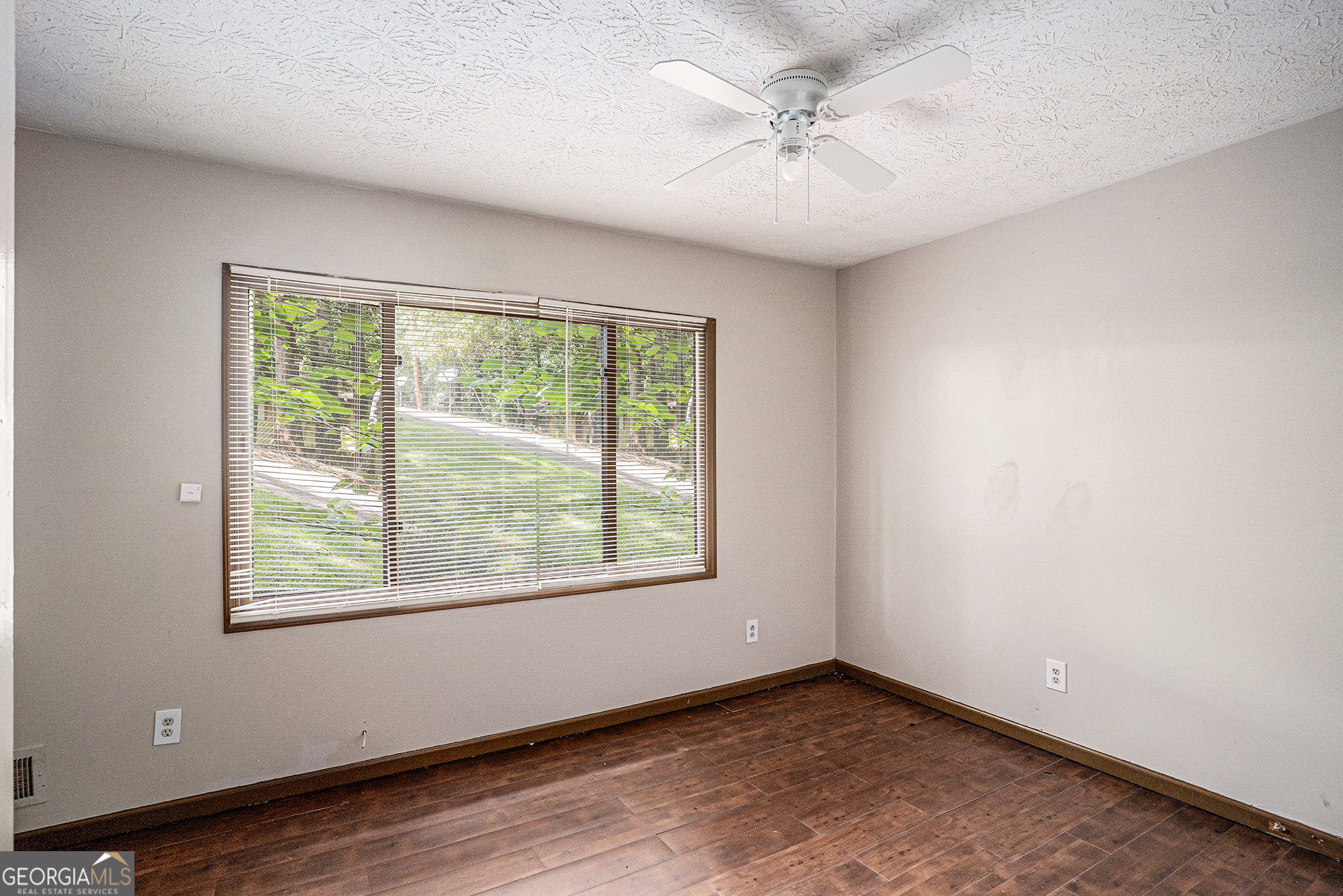 1341 Bethaven Road Riverdale, GA 30296 - Photo 13 of 18 an empty room with windows and ceiling fan