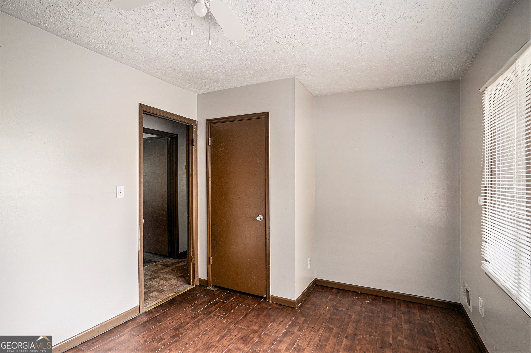 1341 Bethaven Road Riverdale, GA 30296 - Photo 14 of 18 an empty room with wooden floor and windows
