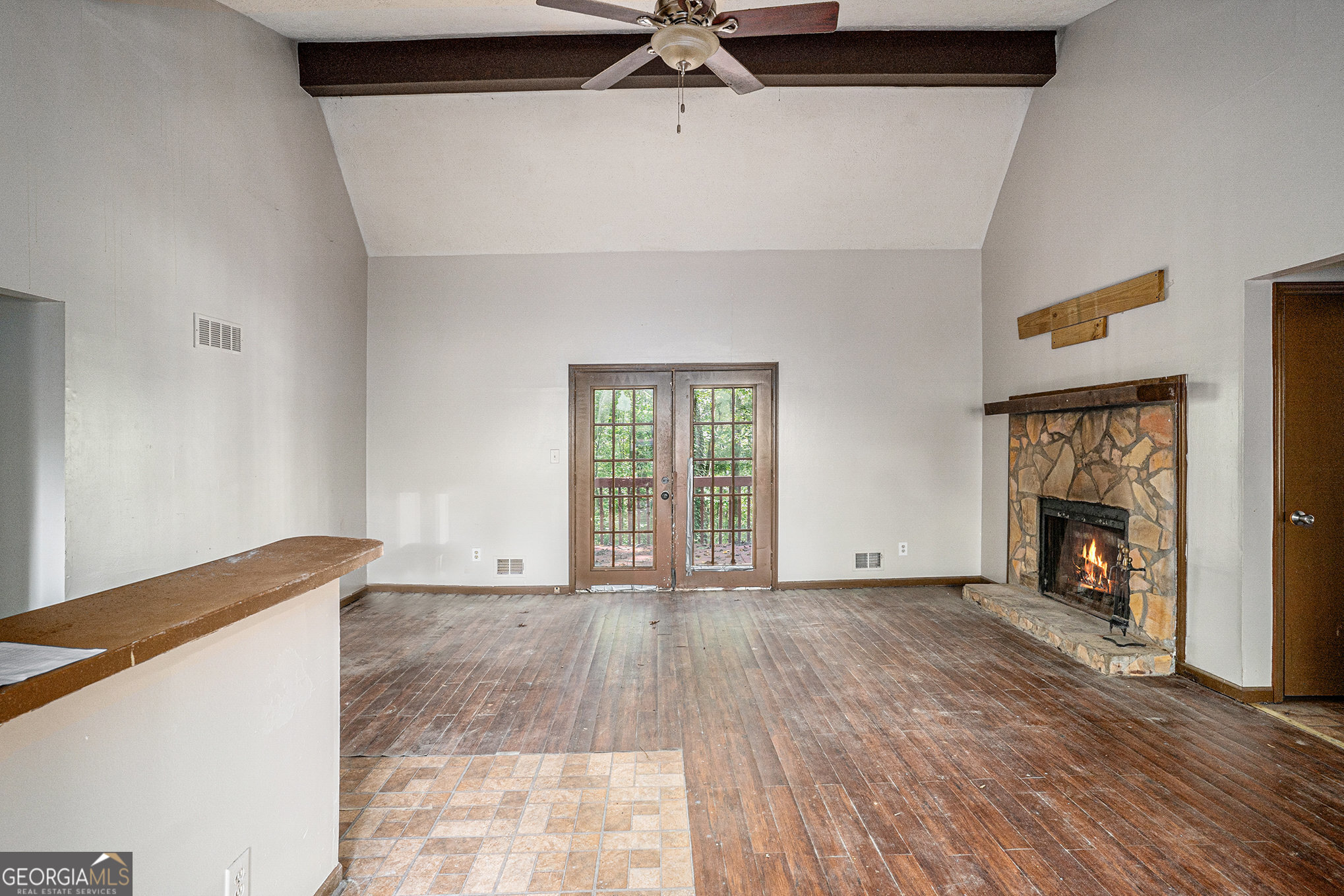 1341 Bethaven Road Riverdale, GA 30296 - Photo 3 of 18 a view of an empty room with a fireplace and a window