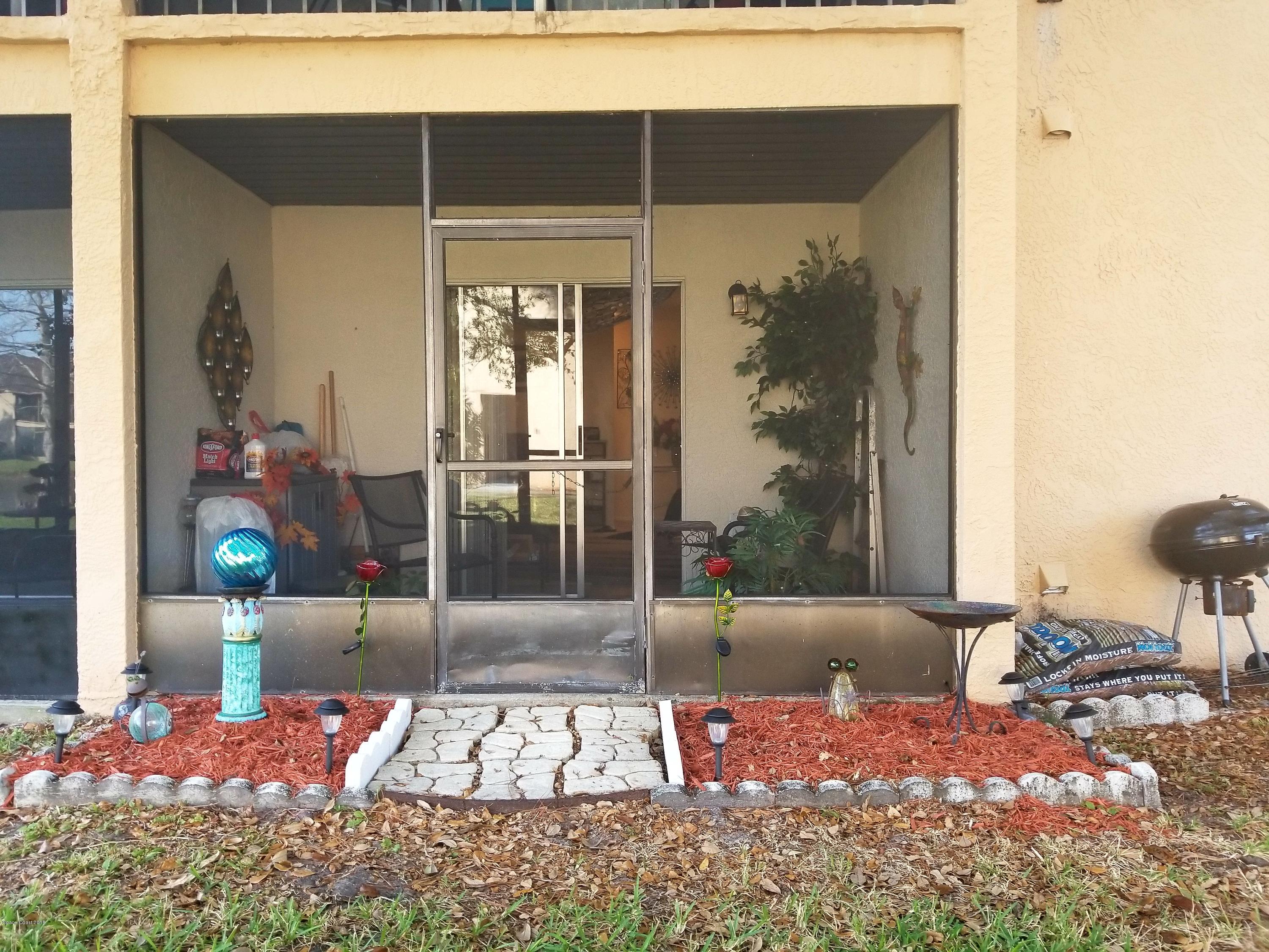 290 Spring Drive, Unit 1 Merritt Island, FL 32953 - Photo 19 of 24 Porch & Garden