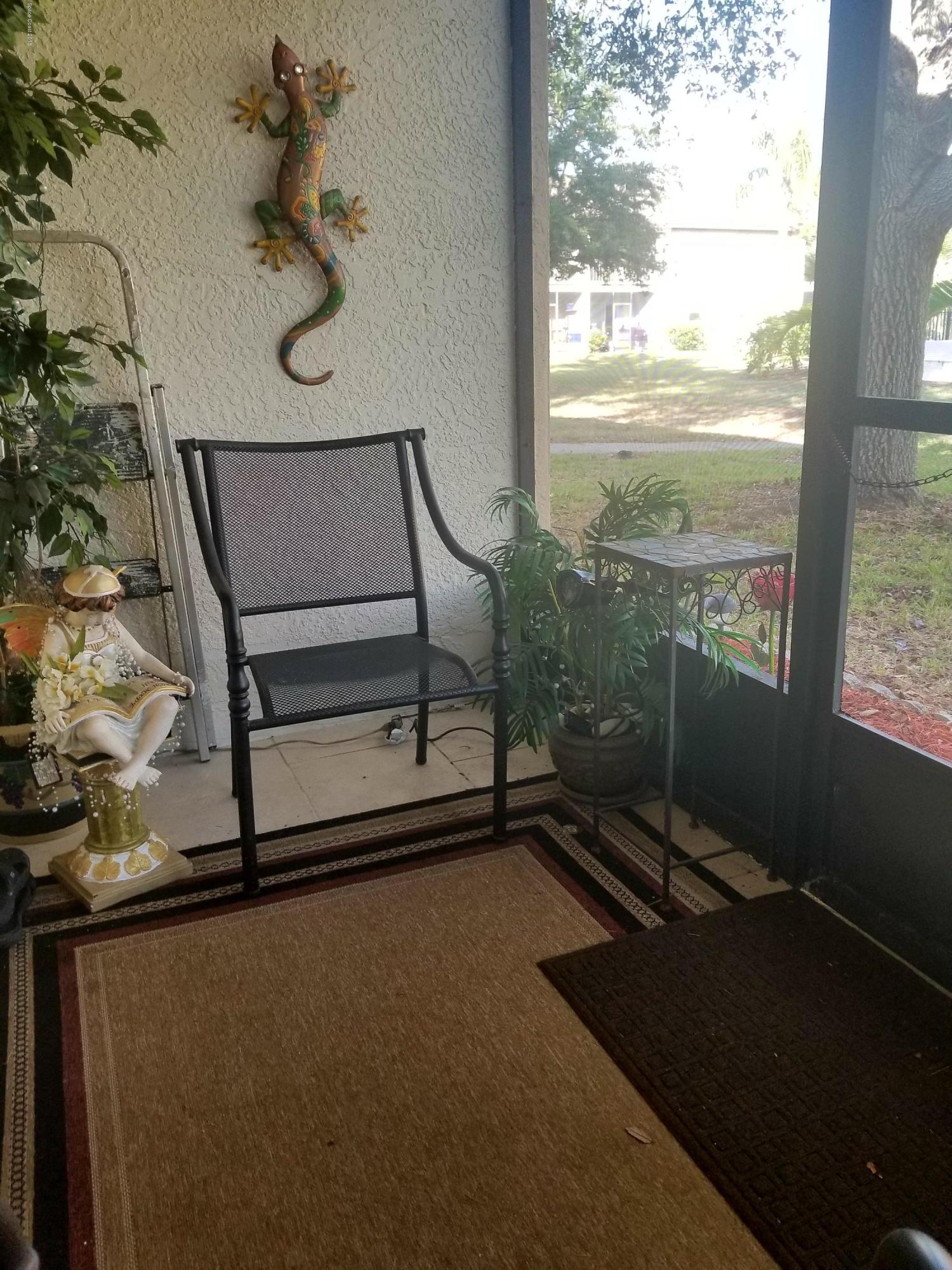 290 Spring Drive, Unit 1 Merritt Island, FL 32953 - Photo 20 of 24 Screened porch
