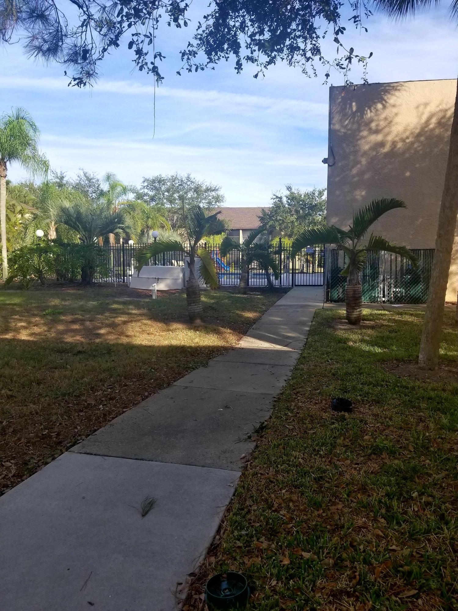 290 Spring Drive, Unit 1 Merritt Island, FL 32953 - Photo 21 of 24 Steps from the pool