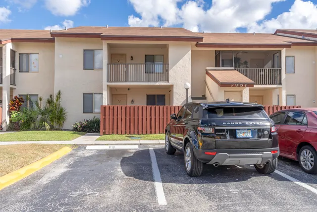 a view of a car in front of house