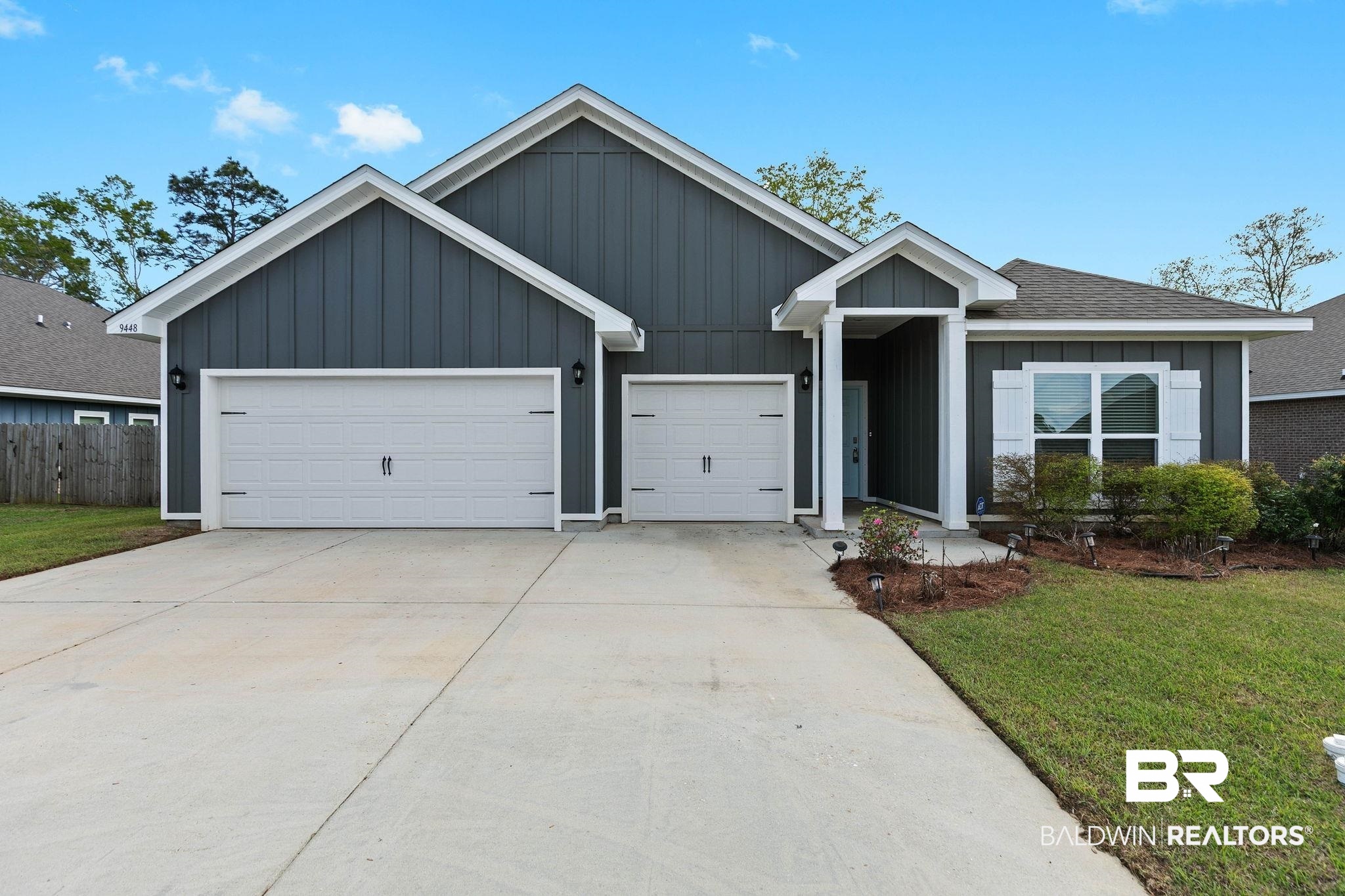 9448 Amethyst Drive Daphne, AL 36526 - Photo 50 of 61 Single story home with board and batten siding, driveway, a garage, and a shingled roof