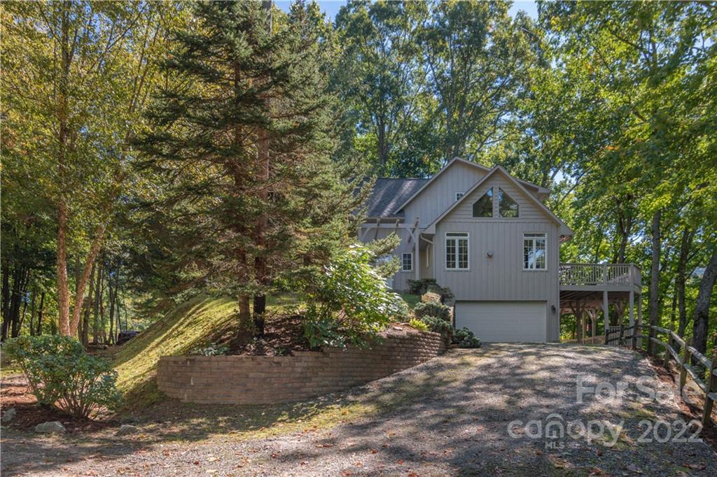 363 Smokey Ridge Loop Waynesville, NC 28786 - Photo 26 of 29 a front view of a house with a yard