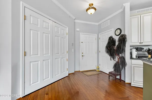 a view of entryway with wooden floor