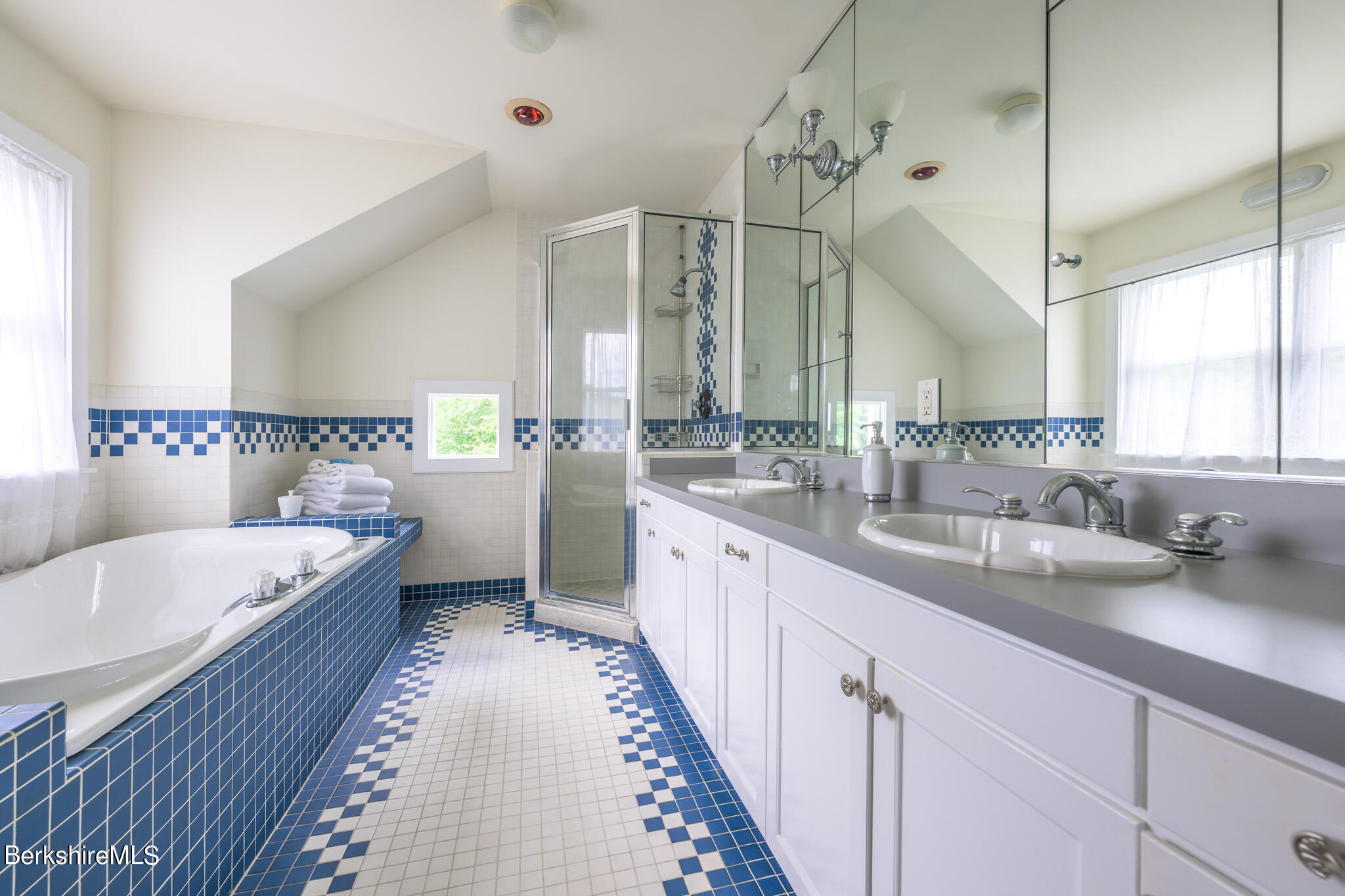 176 West Center Road West Stockbridge, MA 01266 - Photo 27 of 57 a large bathroom with a double vanity sink a mirror and a bathtub