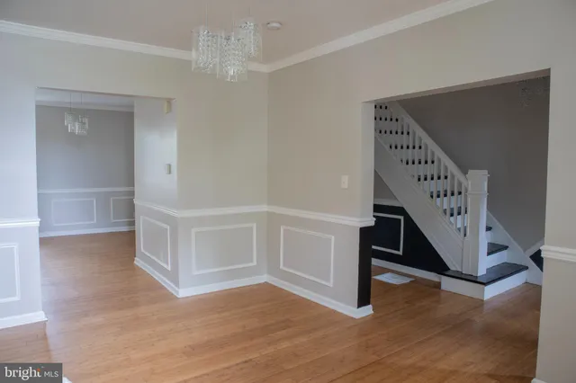 a view of an entryway with wooden floor