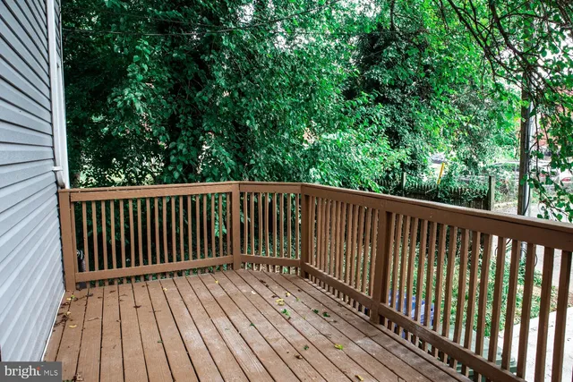 a view of balcony with wooden floor