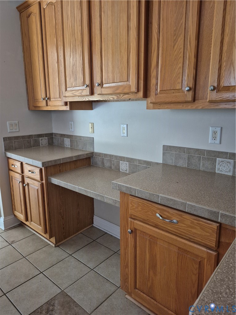 10541 Continental Road Quinton, VA 23141 - Photo 9 of 15 Wood-finish cabinetry with silver-tone hardware, t