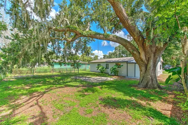 a view of a house with a big yard