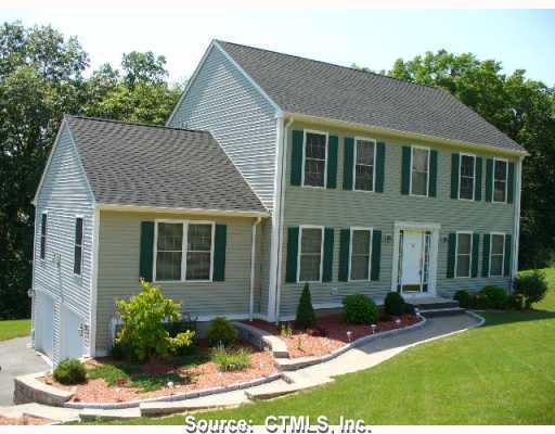 65 Howard Lane Thomaston, CT 06787 - Photo 1 of 1 a front view of a house with a yard