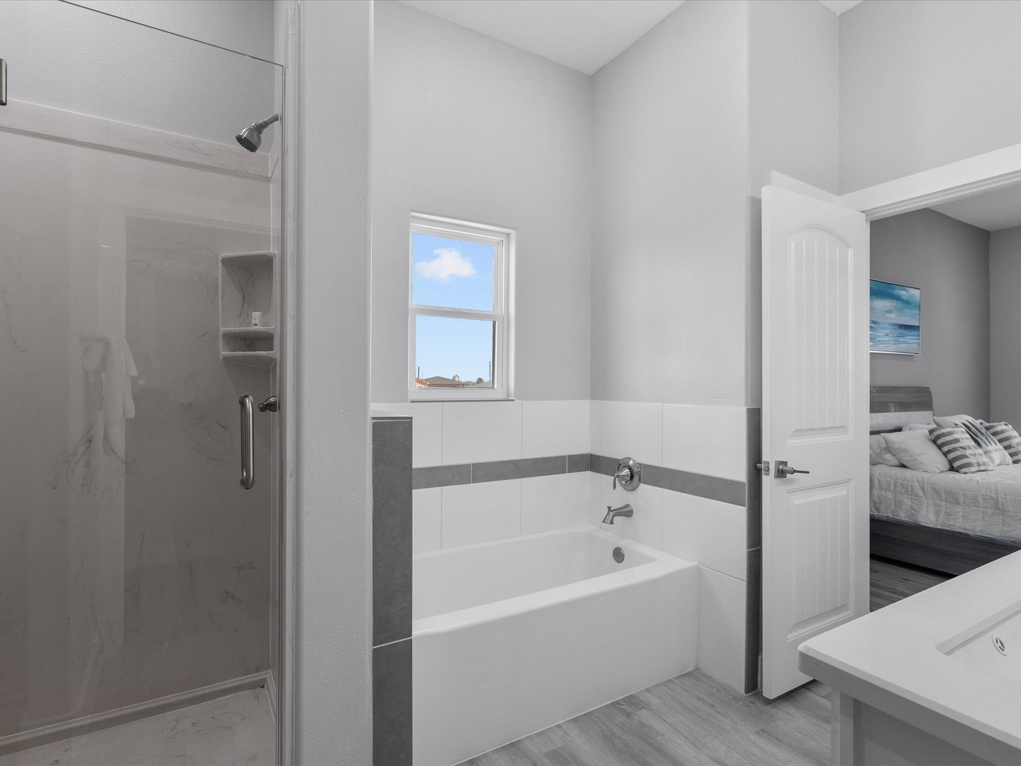 718 Beach Drive Surfside Beach, TX 77541 - Photo 27 of 49 Discover a vibrant and modern room featuring colorful bunk beds with easy ladder access. The recessed lighting enhances its bright, playful ambiance, perfect for a kids' haven or guest retreat.