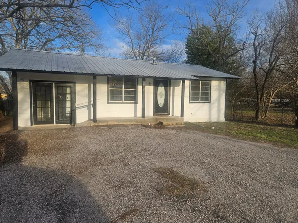 front view of a house with a empty space