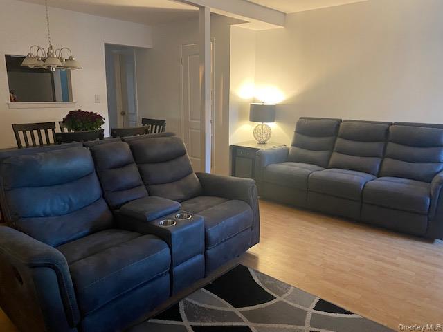 75 Rocky Point Yaphank Road, Unit 133 Rocky Point, NY 11778 - Photo 15 of 15 a living room with furniture and a window