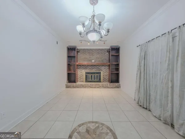 a view of a hallway with a chandelier and chandelier