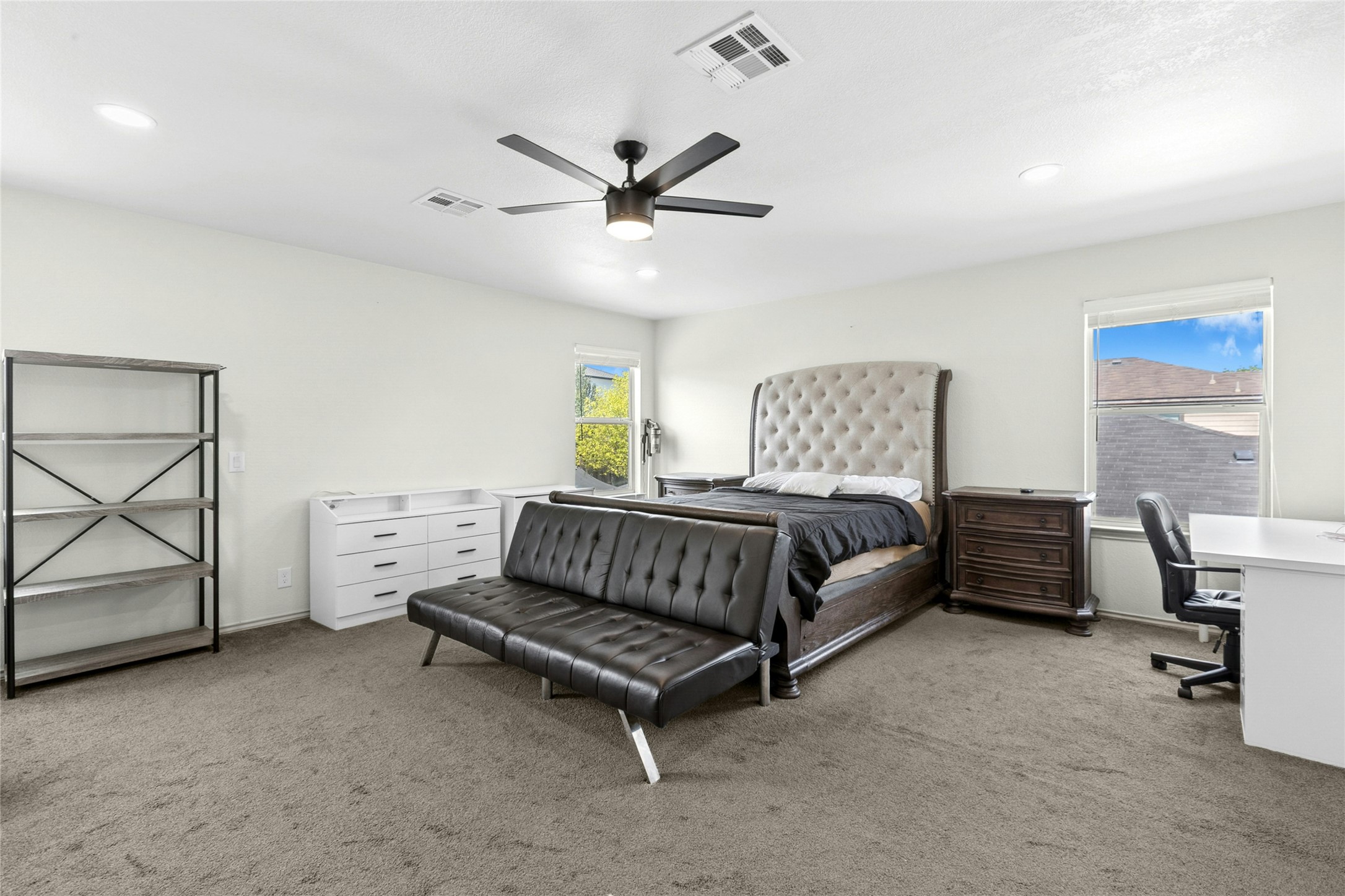 245 Myrtle Street Kyle, TX 78640 - Photo 12 of 24 As you navigate upstairs, you'll see the master Bedroom with light carpet, an office area, and ceiling fan