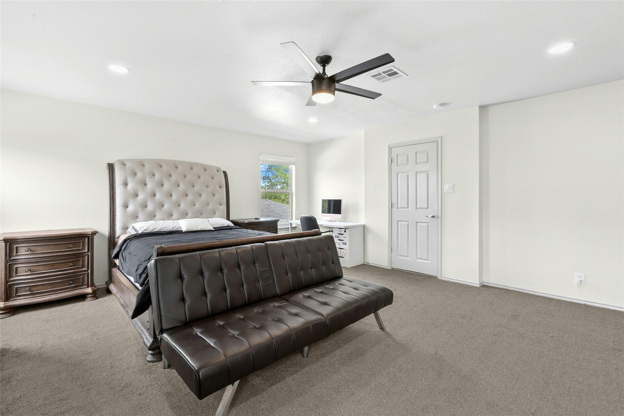 245 Myrtle Street Kyle, TX 78640 - Photo 13 of 24 Master Bedroom with carpet, ceiling fan, and recessed lighting