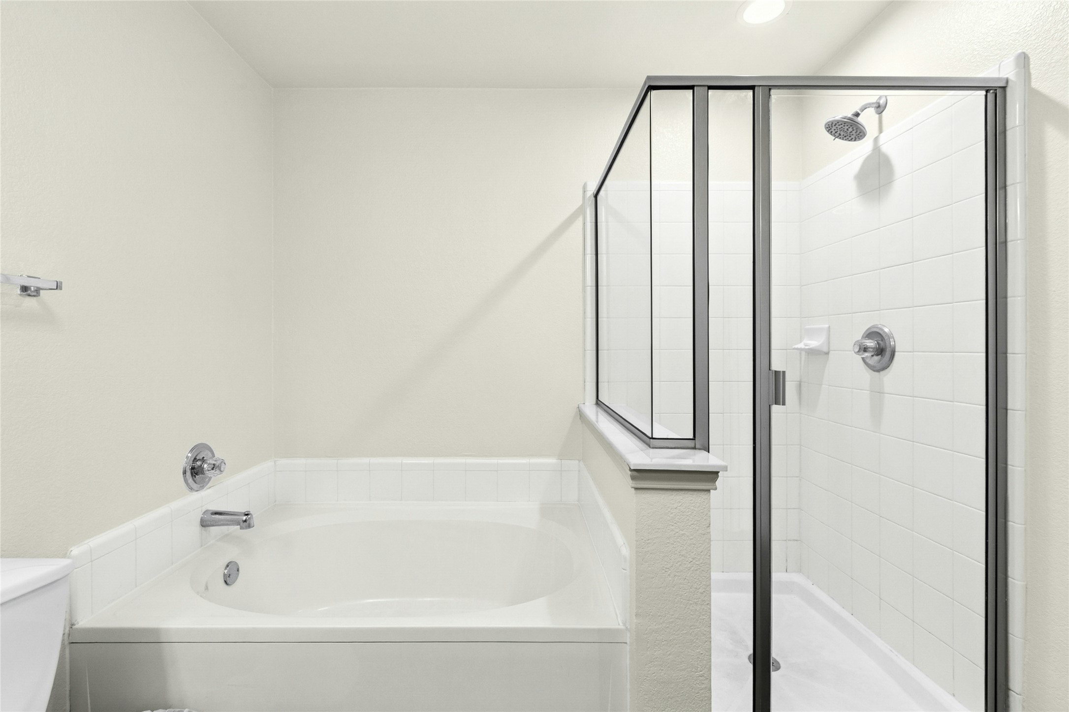 245 Myrtle Street Kyle, TX 78640 - Photo 15 of 24 Master Bathroom featuring a shower stall and a garden tub