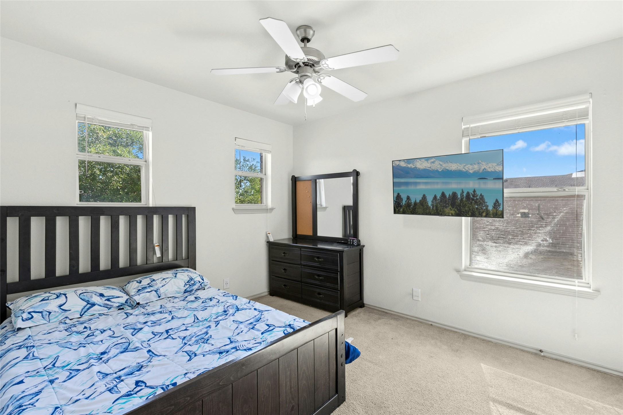 245 Myrtle Street Kyle, TX 78640 - Photo 16 of 24 Bedroom featuring light colored carpet and ceiling fan