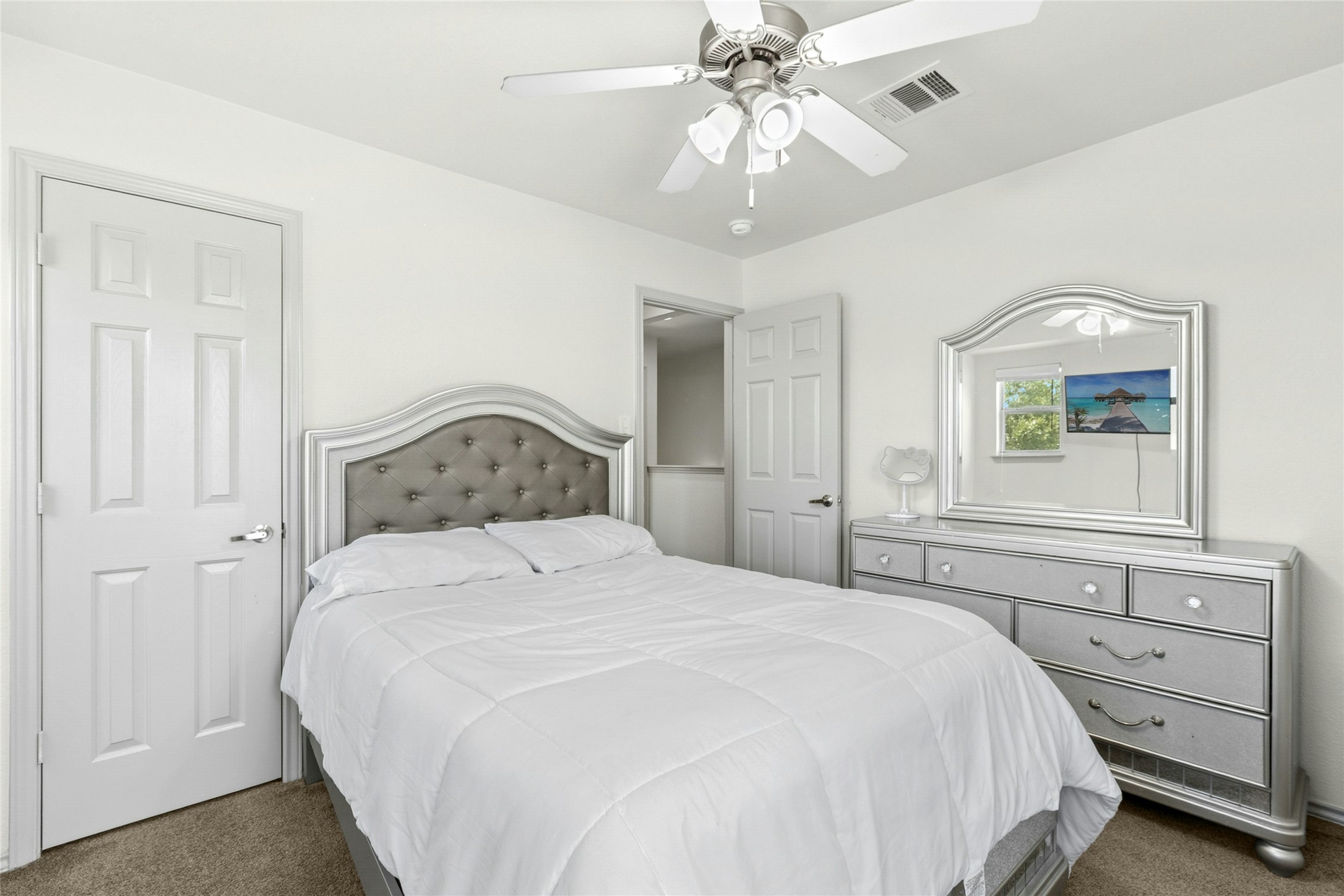 245 Myrtle Street Kyle, TX 78640 - Photo 18 of 24 Bedroom with dark carpet and ceiling fan