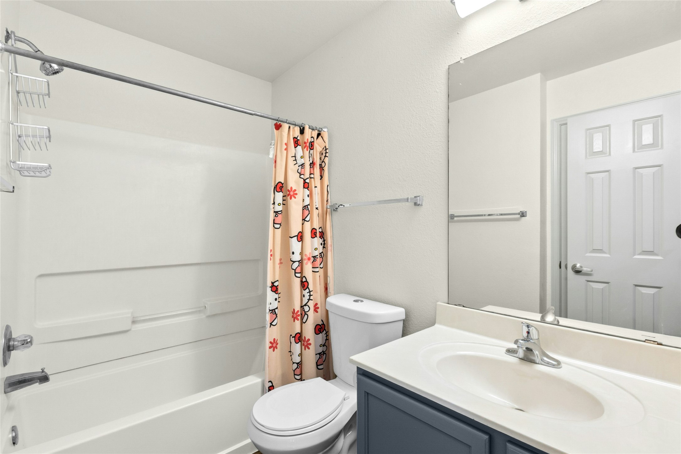 245 Myrtle Street Kyle, TX 78640 - Photo 21 of 24 Bathroom with vanity and shower / bath combo with shower curtain