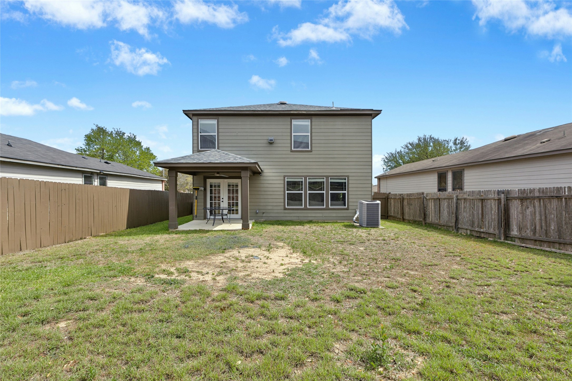 245 Myrtle Street Kyle, TX 78640 - Photo 24 of 24 Rear view of property with a patio area, a fenced backyard, and french doors